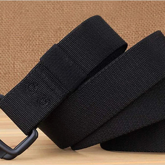 Black belt with leather trim end on a wooden surface