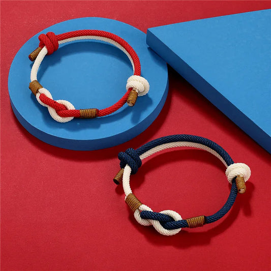 Two braided rope bracelets on a red and blue background