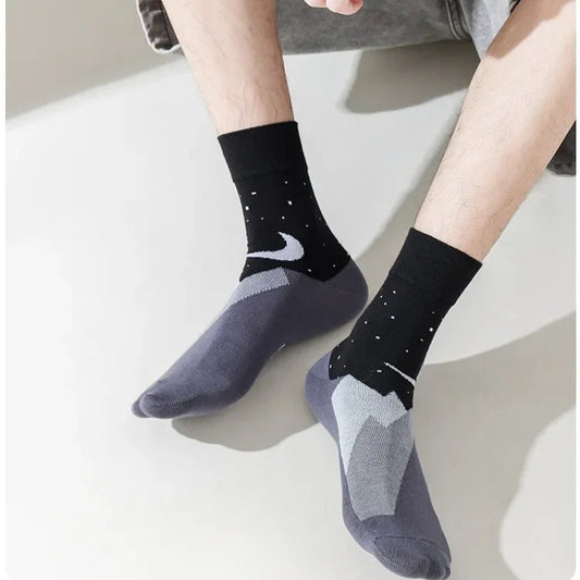 Display of colorful socks with a focus on the model's feet and feet on foot.