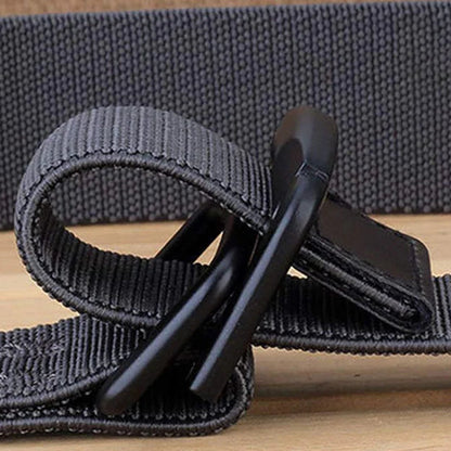 Gray strap with a black clip on a wooden surface