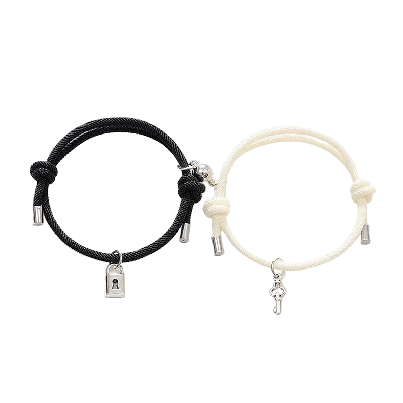 Black and white bracelets with charms on a white background