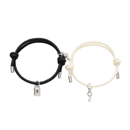 Black and white bracelets with charms on a white background