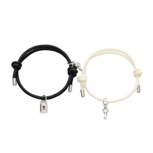 Black and white bracelets with charms on a white background