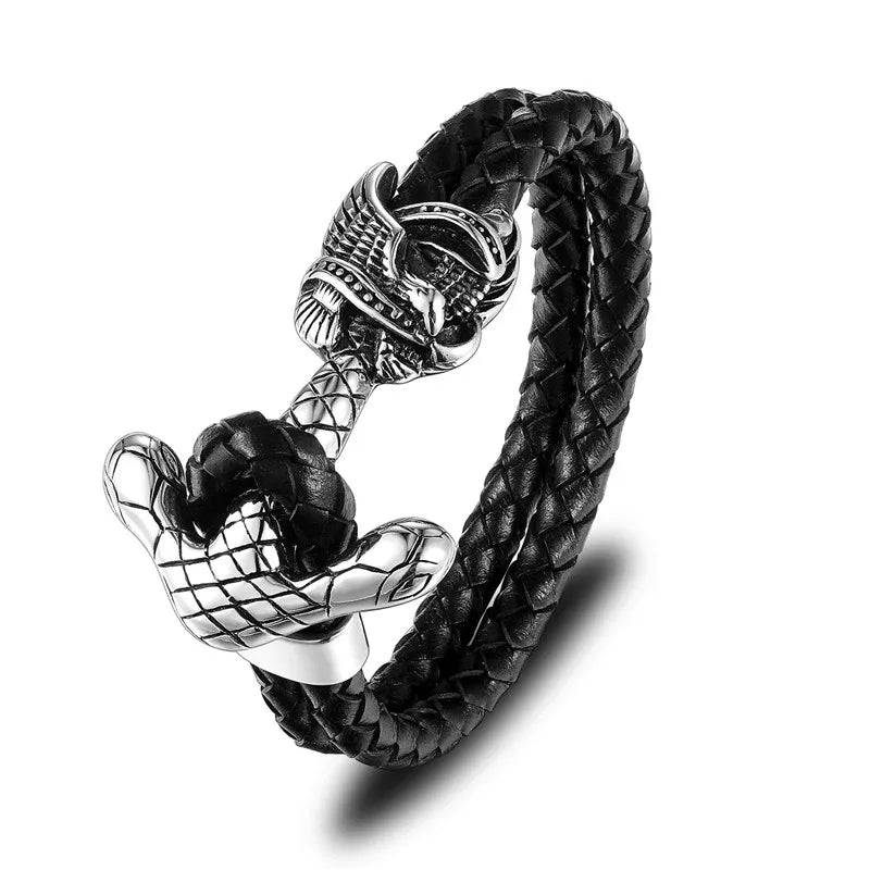 Black braided leather bracelet with silver skull and anchor design on a white background