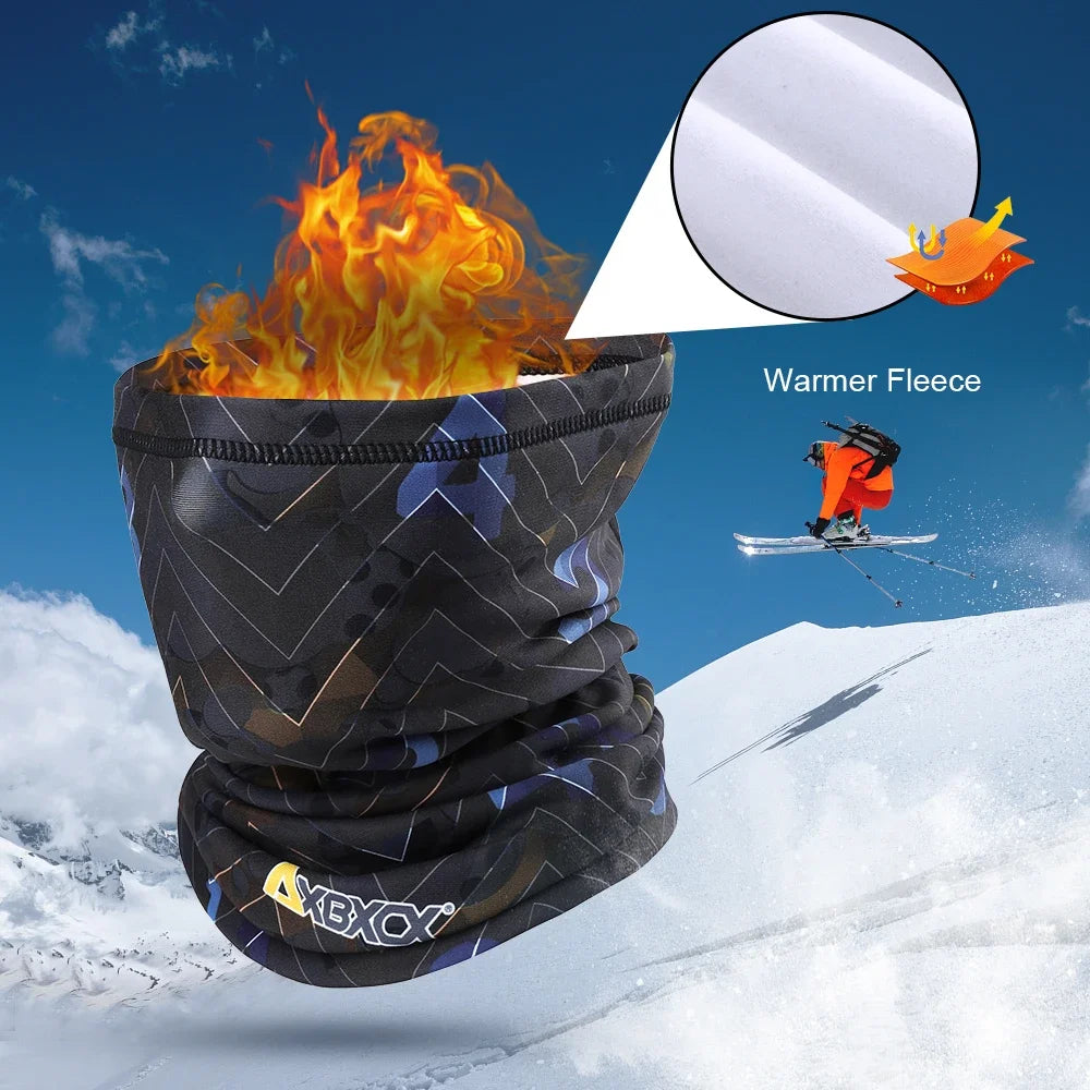 Black neck gaiter with flame effect and skier in the background on a snowy mountain.