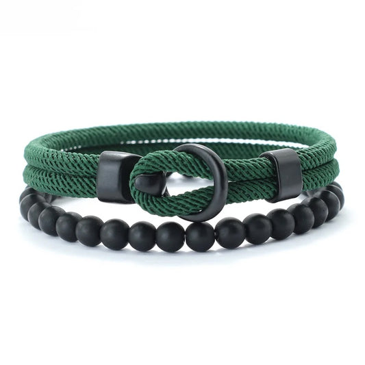 Two bracelets, one green rope-style and one black beaded, on a white background