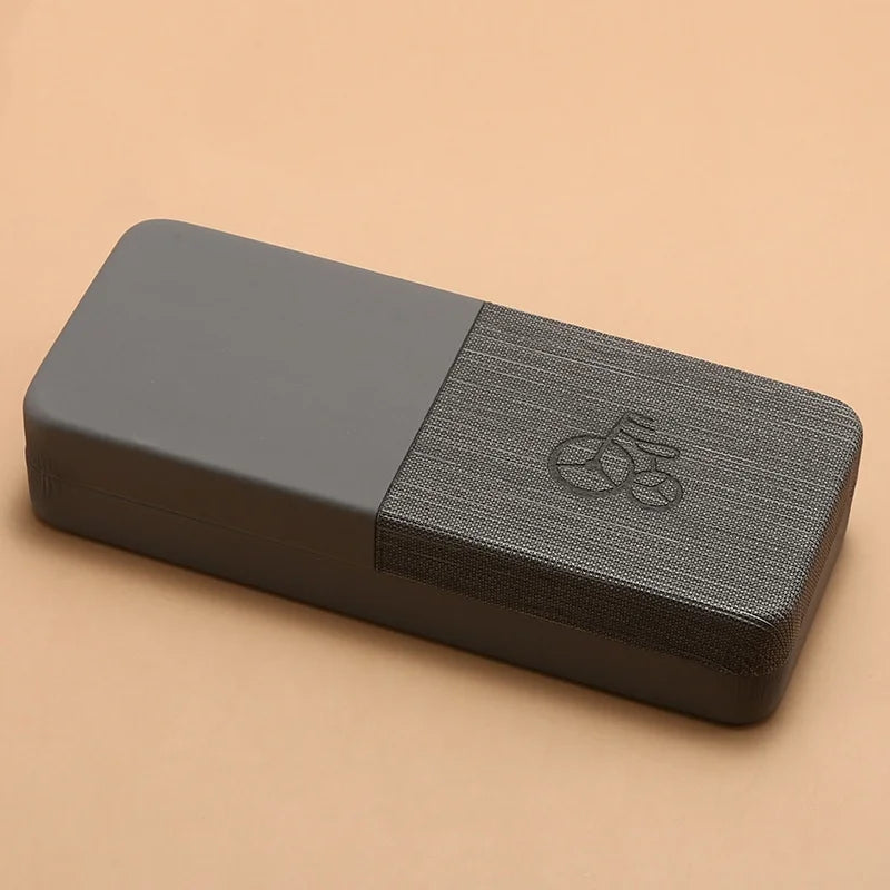 Gray yoga block with a textured surface on a beige background