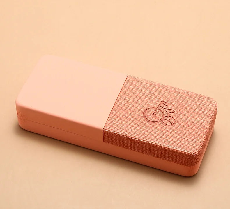 Pink textured box with a logo on a beige background