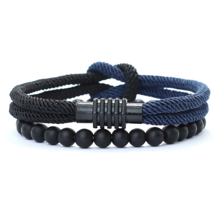 Two bracelets, one with a black braided rope design and the other with red, placed side by side with a silver-colored zinc alloy clasp.