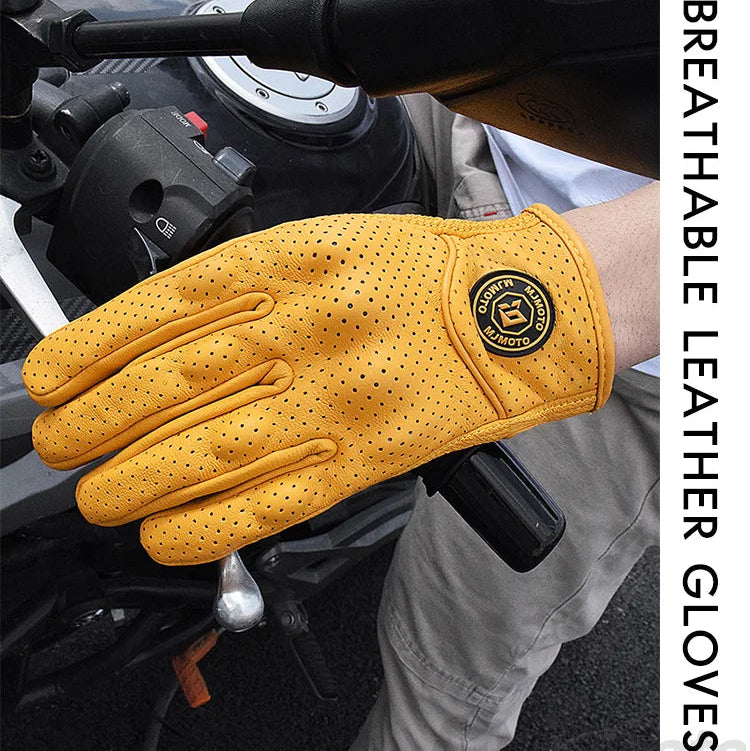 Yellow leather glove with a brand logo on a motorcycle handlebar
