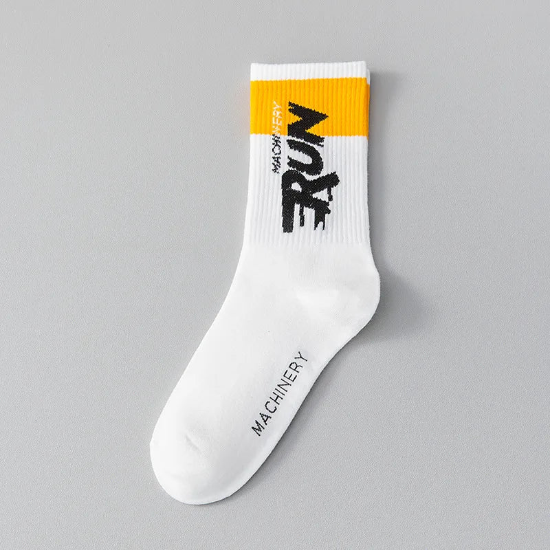 White sock with yellow and black text on a gray background