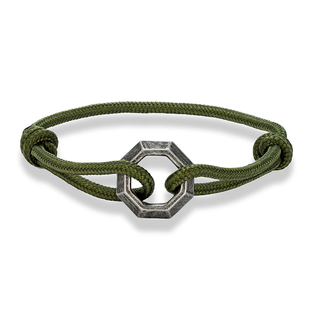 Green bracelet with a silver hexagonal clasp on a white background