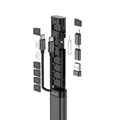 A black multi-functional USB C hub with various ports and adapters, including USB 3.0 and SD card slots, displayed in a exploded view to show the individual components.